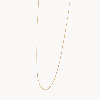 Gold chain necklace on a white background