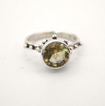 Silver ring with a yellow Quartz gemstone on a white background- Camelot ring