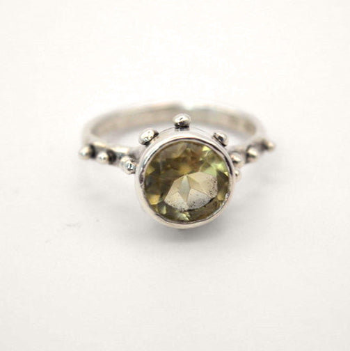 Silver ring with a yellow Quartz gemstone on a white background- Camelot ring
